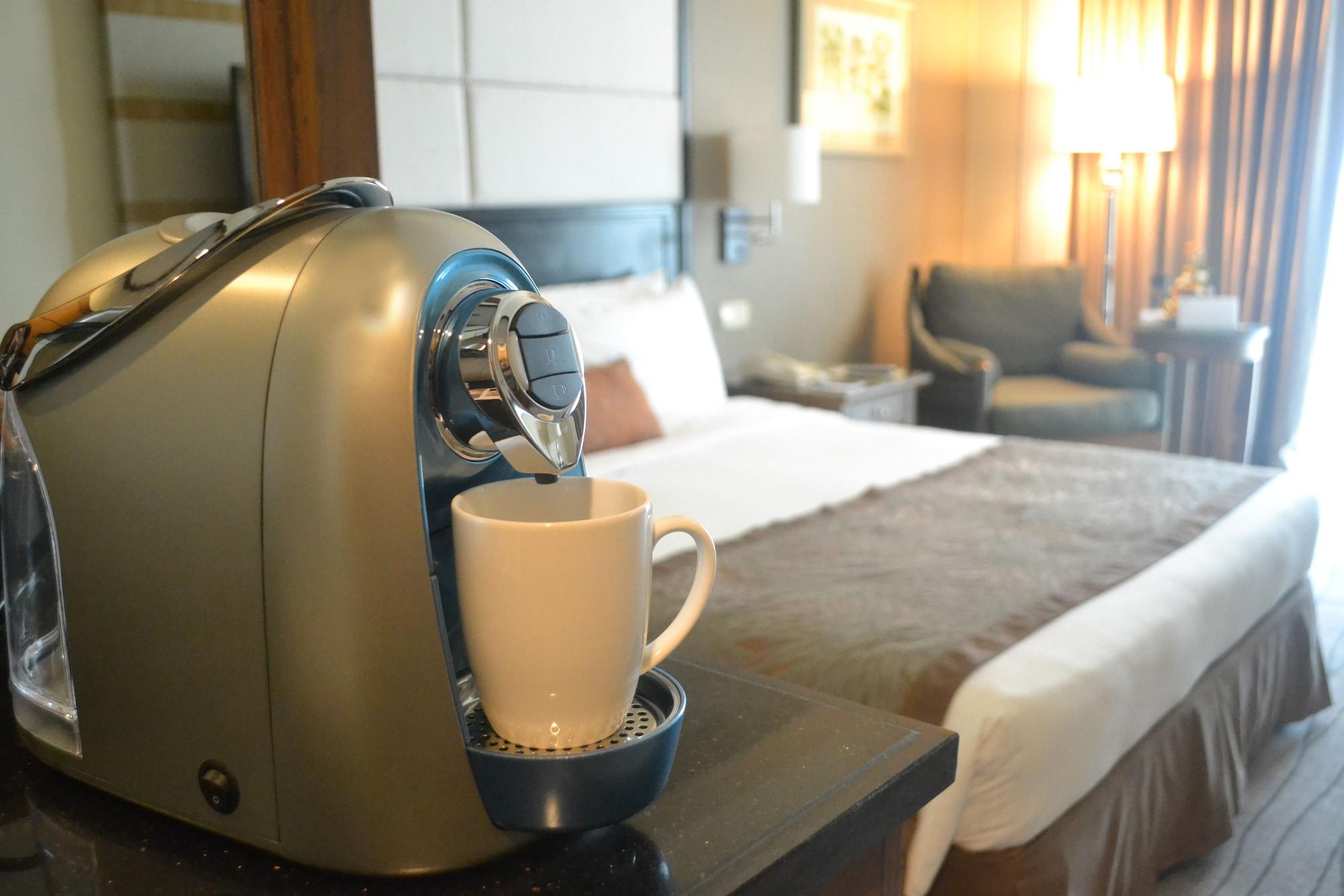 Hotel Marco Polo Davao Stadt Exterior foto A Nespresso machine in a hotel room